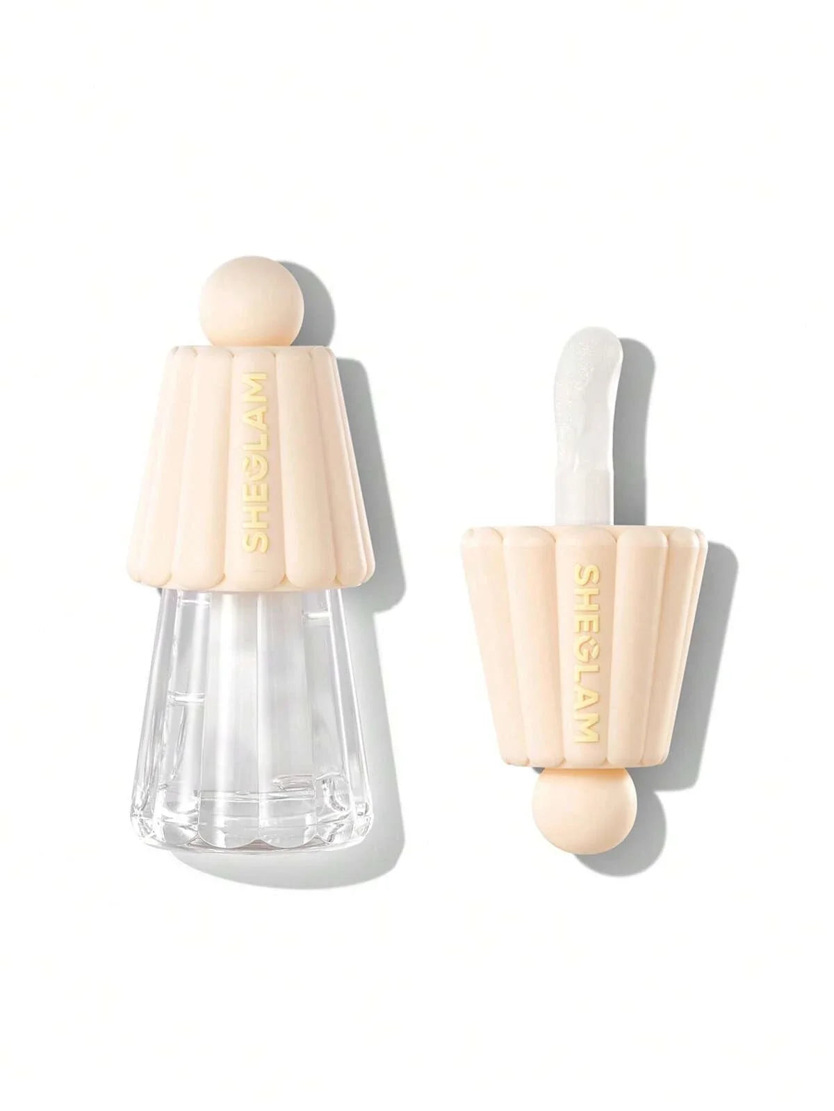 Two cosmetic applicators with beige handles on a white background
