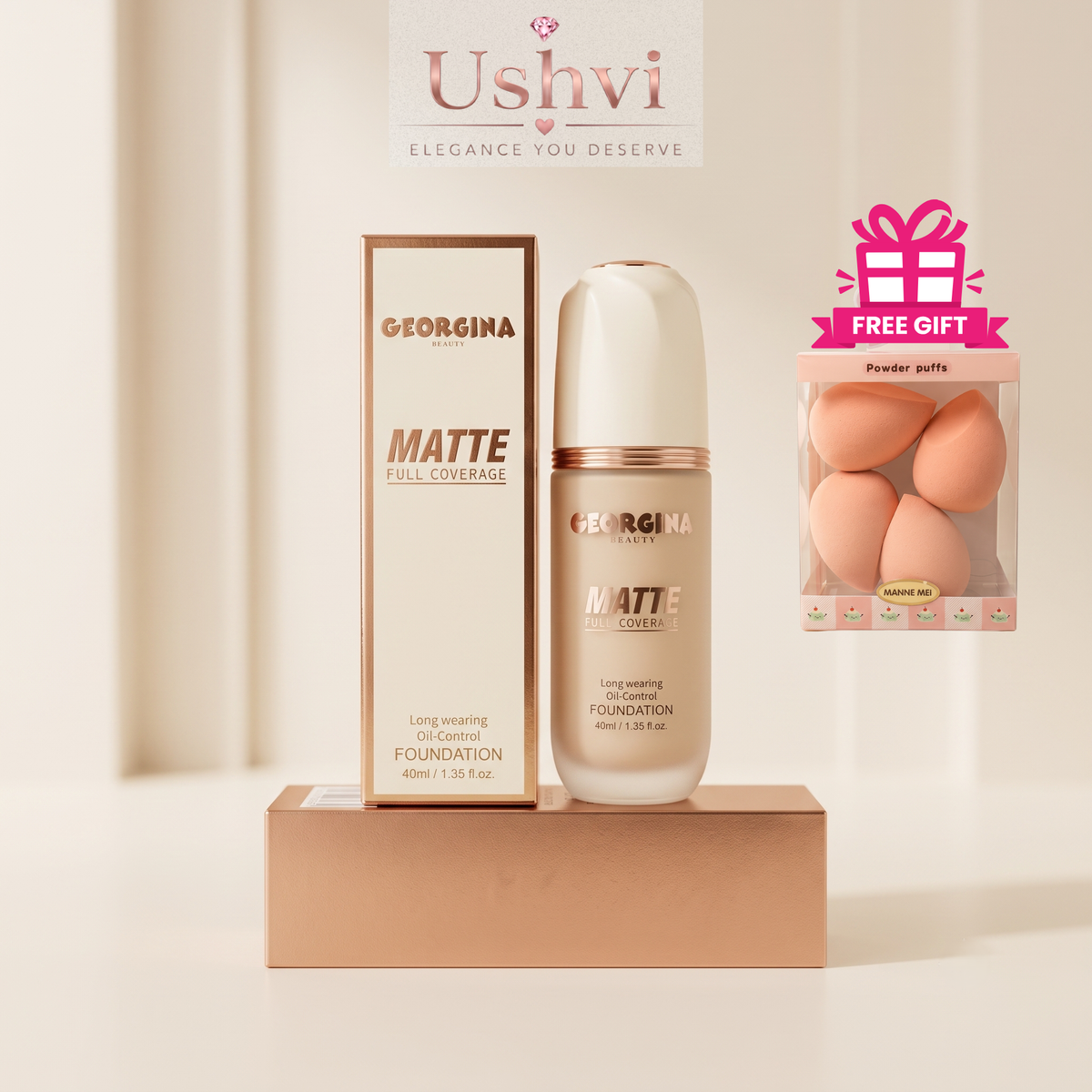 Georgina Mattie Full Coverage Matte Foundation bottle and box displayed on a pedestal, with a pink 'Free Gift' powder puff pack and a Ushvi banner in the background.